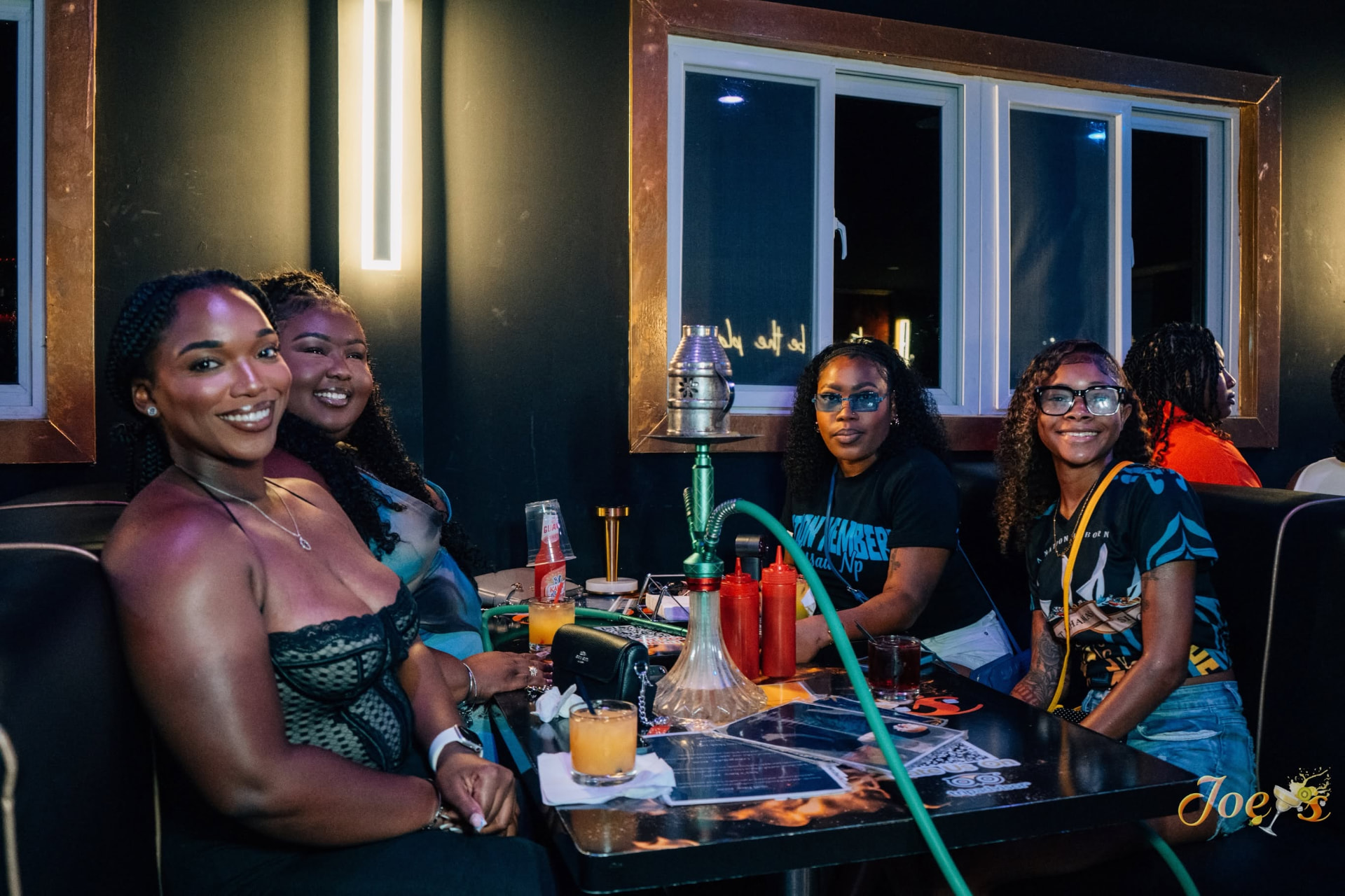 Group enjoying drinks in Joey's lounge